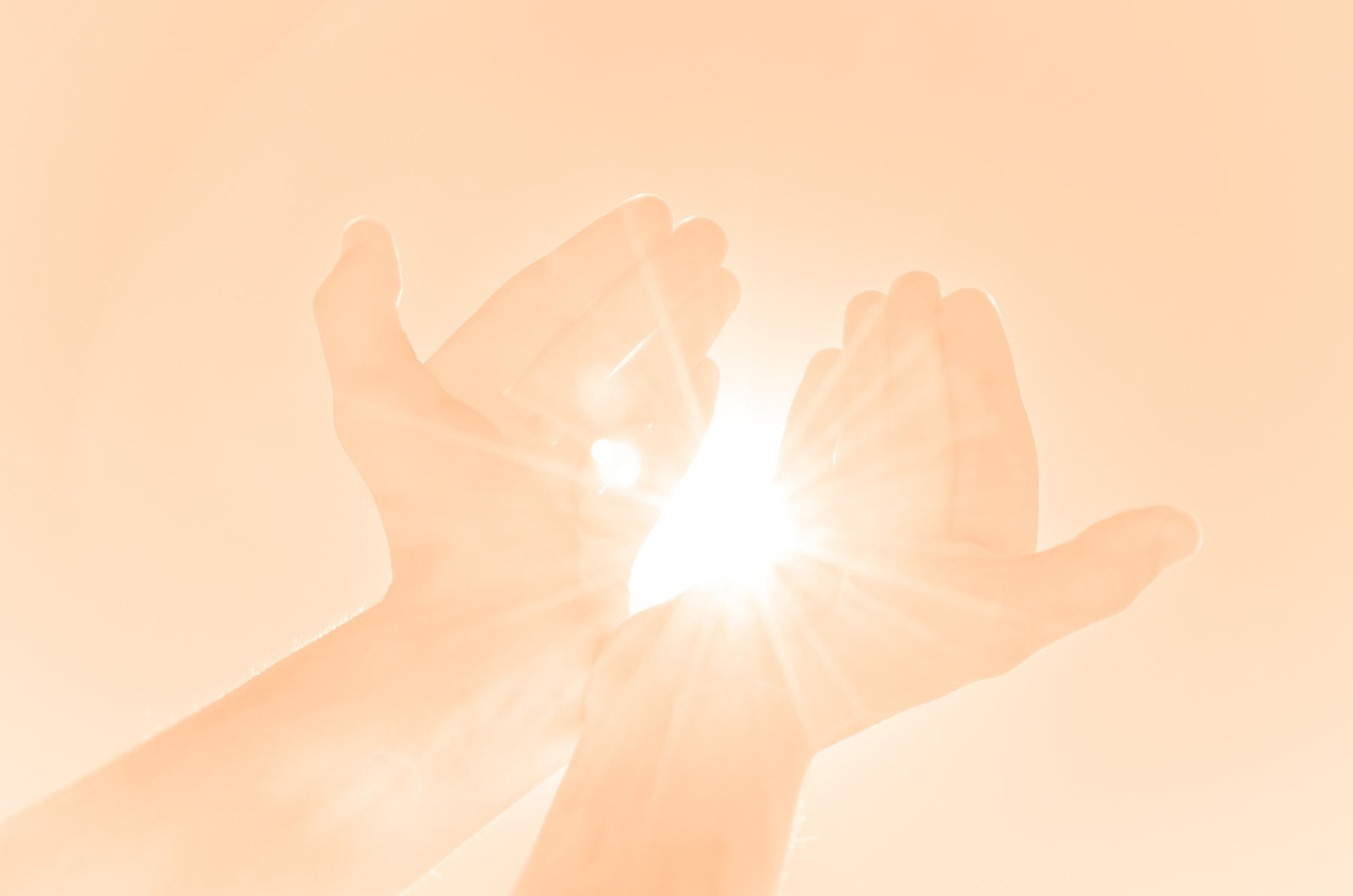 Kind hands offering light